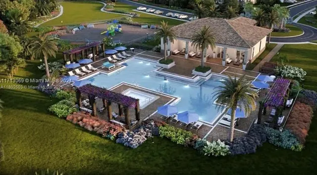 an aerial view of a house with a garden and swimming pool