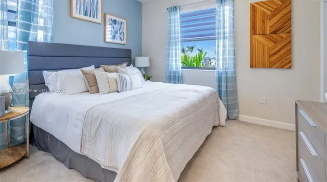 a bedroom with bed and window