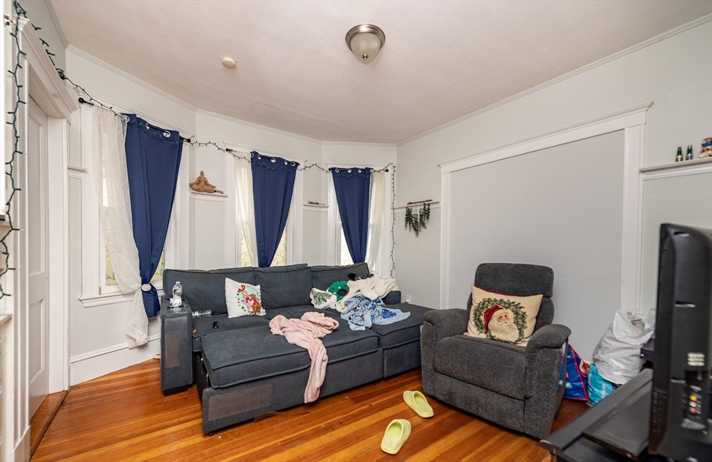 18 Santuit Street Boston, MA 02124 - Photo 15 of 17 a living room with furniture and a window