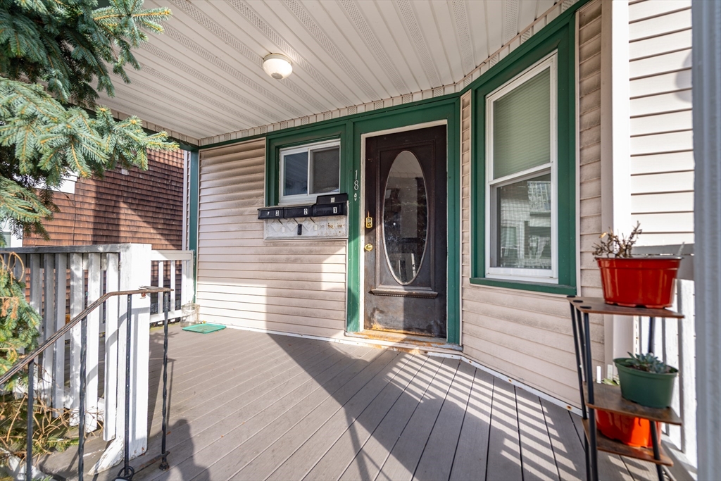 18 Santuit Street Boston, MA 02124 - Photo 6 of 17 a front view of a house with a porch
