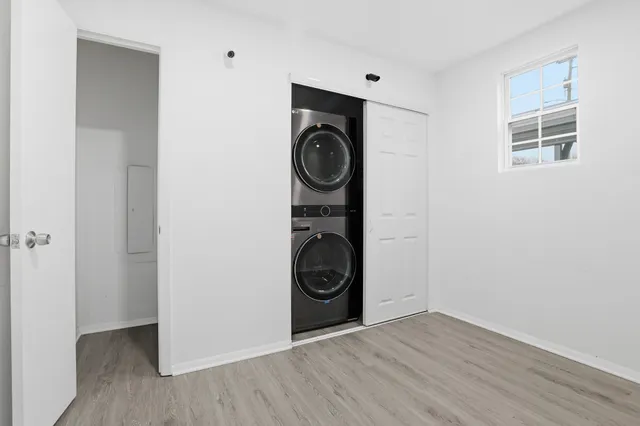 a view of an entryway with wooden floor