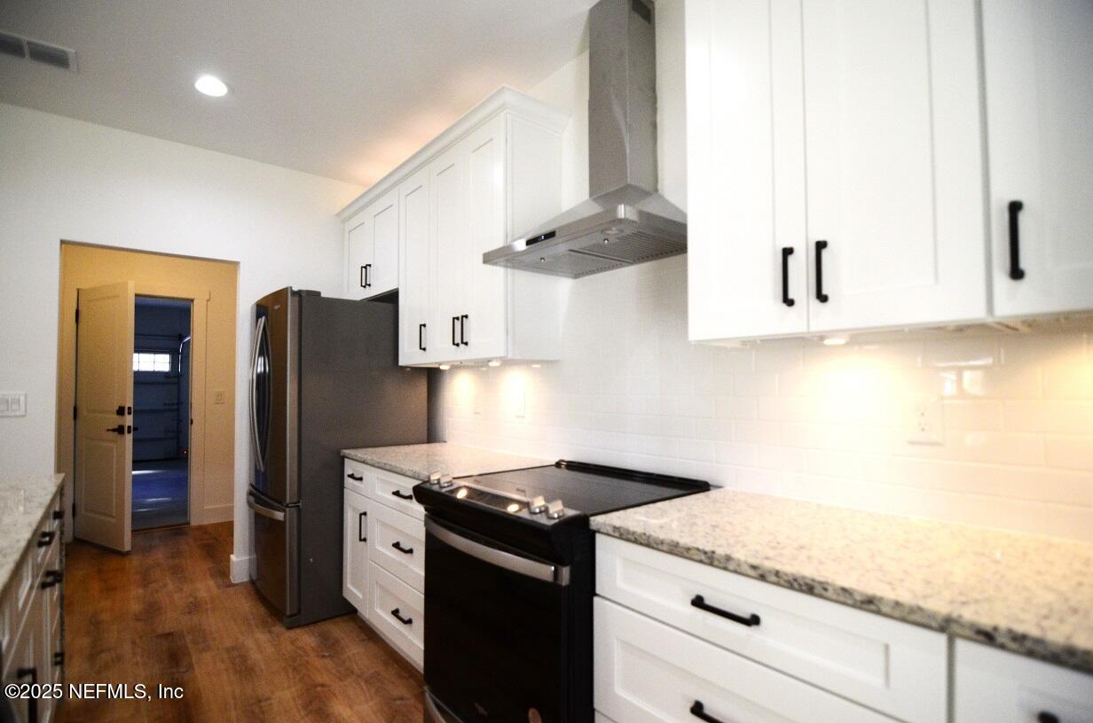 12724 Danbrook Street Jacksonville, FL 32223 - Photo 14 of 42 a kitchen with stainless steel appliances granite countertop a refrigerator and a stove