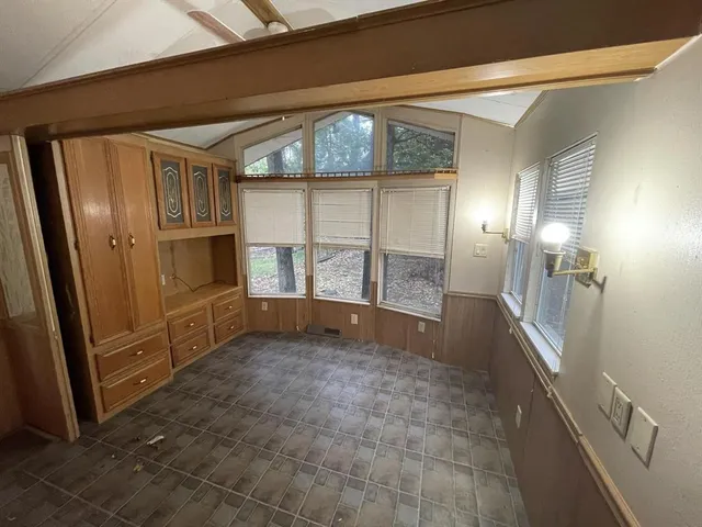 a kitchen with stainless steel appliances a stove a sink and a refrigerator