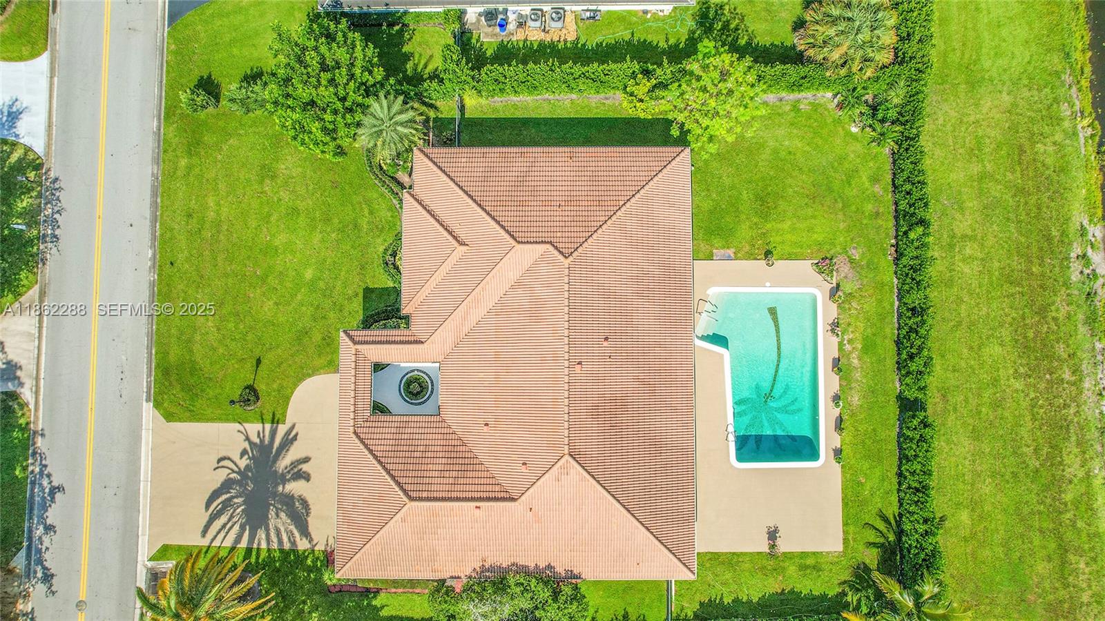 524 Muirfield Drive Atlantis, FL 33462 - Photo 51 of 55 an aerial view of a house with a yard