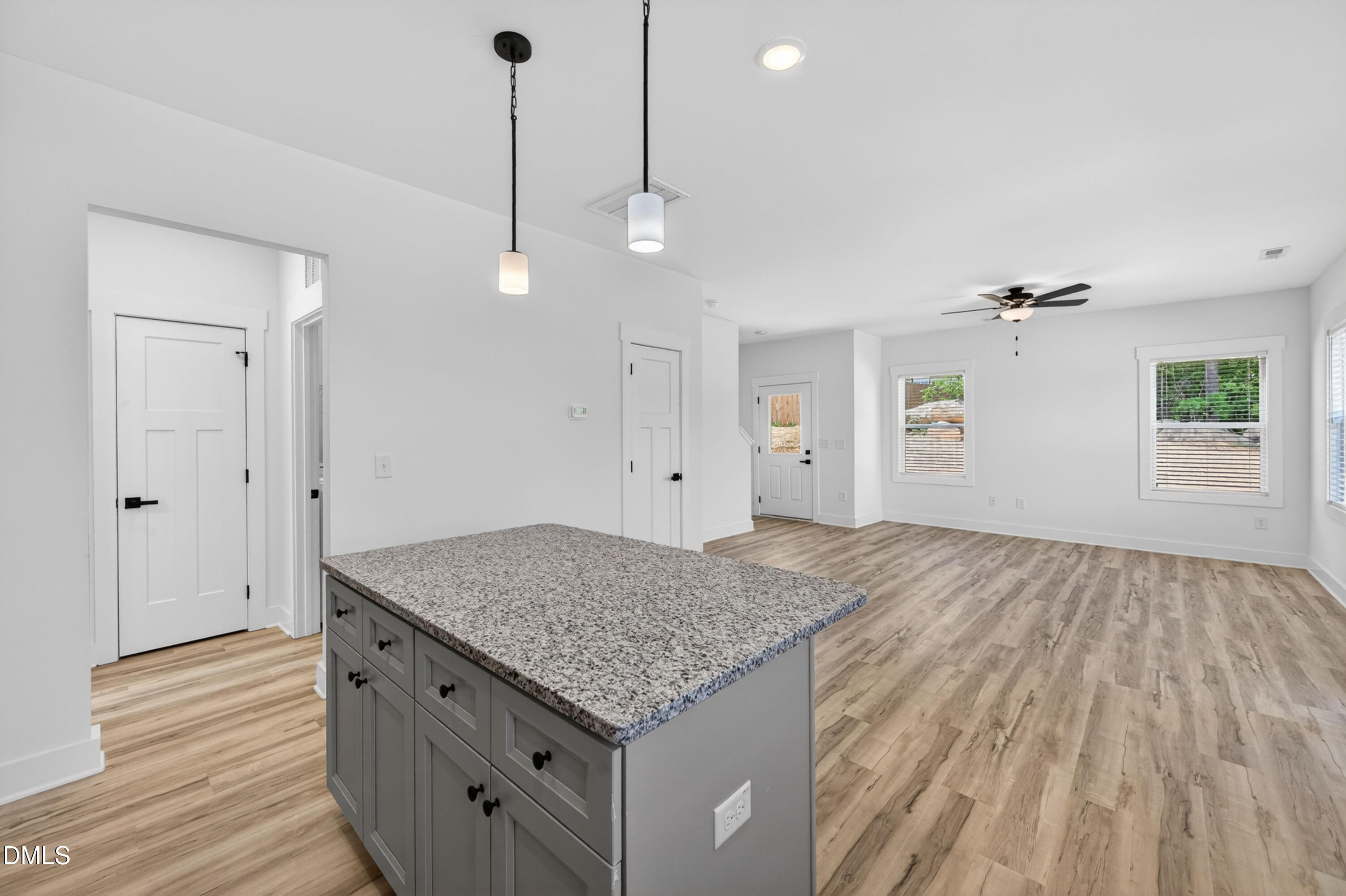 1182 Hurdle Mills Road Roxboro, NC 27573 - Photo 13 of 45 a kitchen with a sink and chandelier