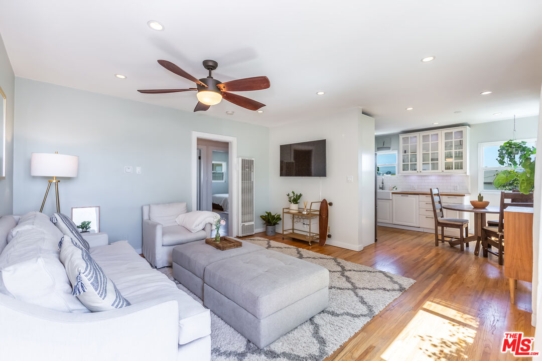 1835 7th Street, Unit D Santa Monica, CA 90401 - Photo 1 of 9 a living room with furniture and a wooden floor