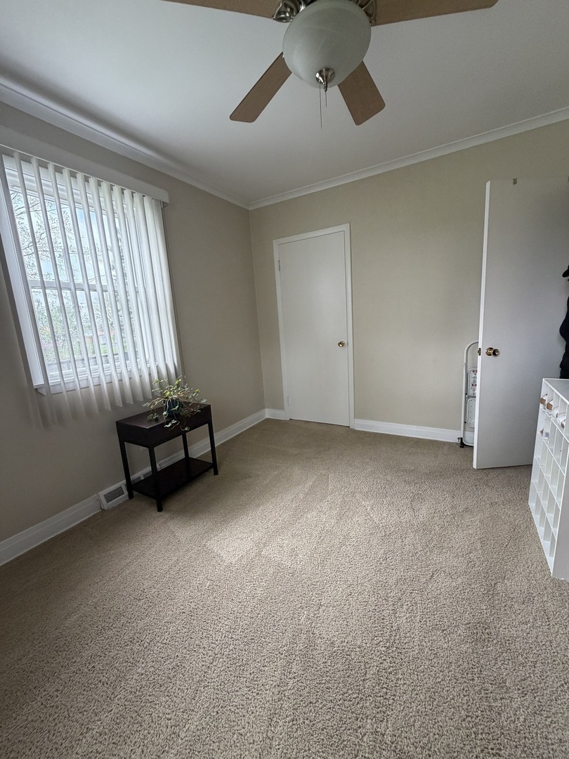 3935 Arthur Terrace Court Markham, IL 60428 - Photo 13 of 22 a view of an empty room with a window and a fireplace