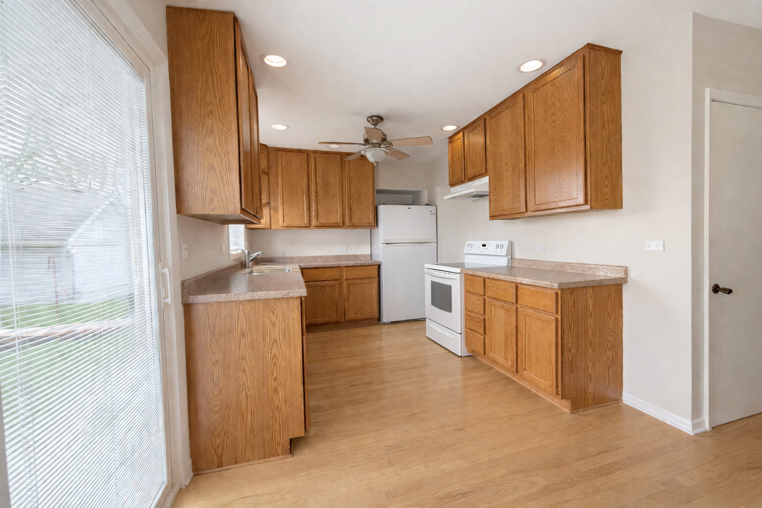 3935 Arthur Terrace Court Markham, IL 60428 - Photo 4 of 22 a kitchen with a sink cabinets and a window