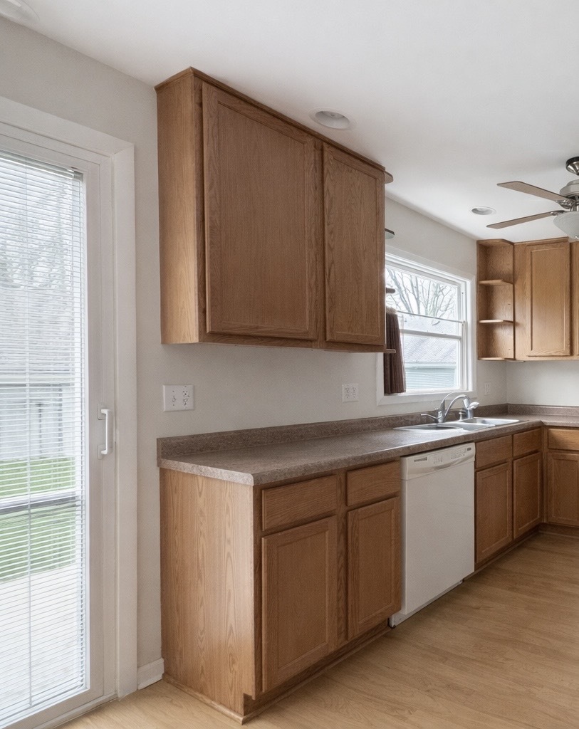 3935 Arthur Terrace Court Markham, IL 60428 - Photo 5 of 22 a kitchen with stainless steel appliances granite countertop a sink and a stove top oven