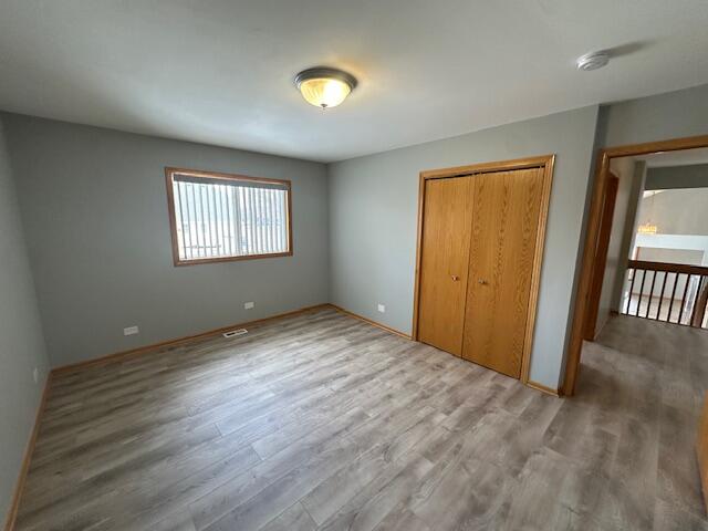 9924 Lands End Munster, IN 46321 - Photo 26 of 42 an empty room with wooden floor and windows