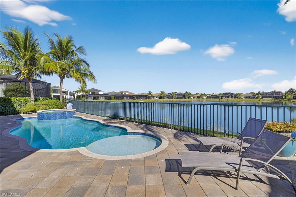 a view of a swimming pool with a patio and a garden