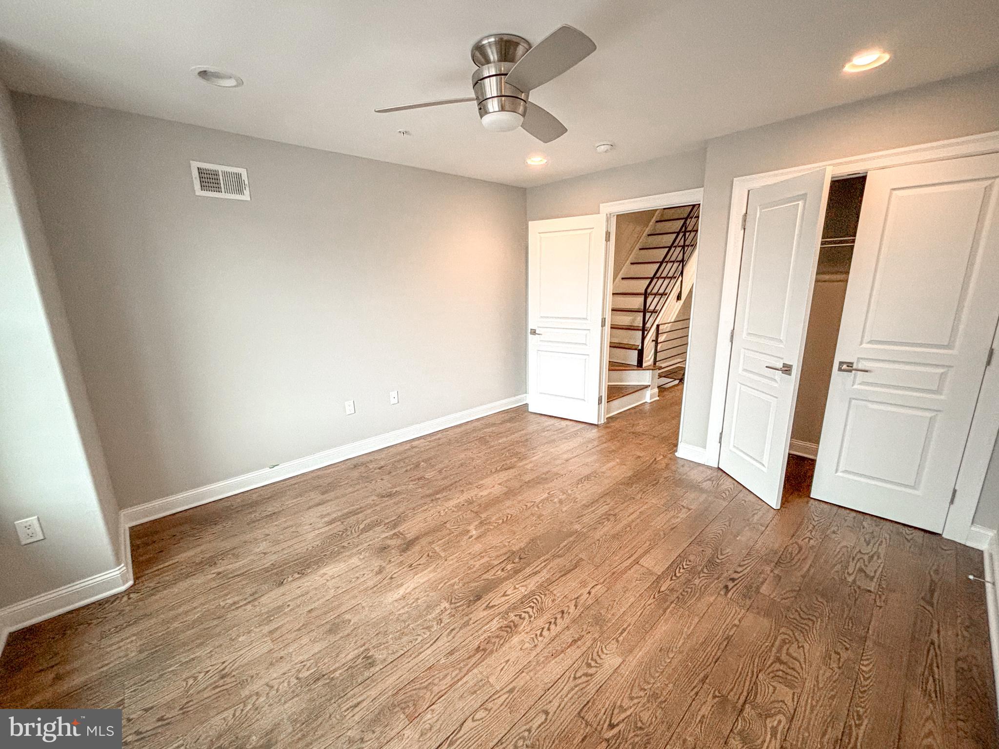 1526 South Cleveland Street Philadelphia, PA 19146 - Photo 12 of 30 wooden floor in an empty room with a window