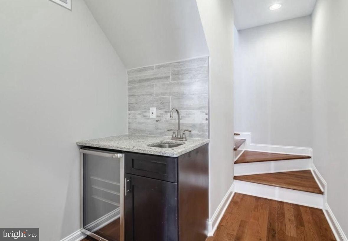 1526 South Cleveland Street Philadelphia, PA 19146 - Photo 22 of 30 a kitchen with a sink and a refrigerator