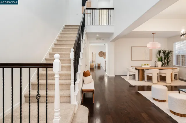 a view of a living room and dining room