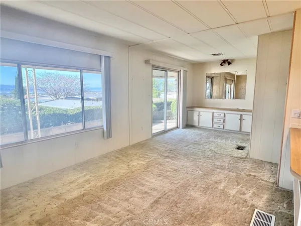 a view of an empty room with a window