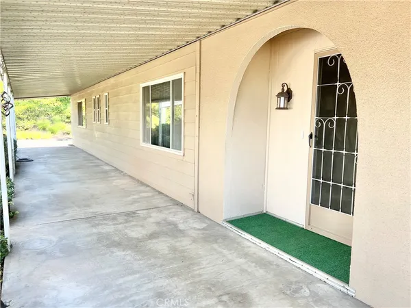 a view of house with backyard