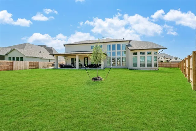 a view of a balcony with two chairs and a table