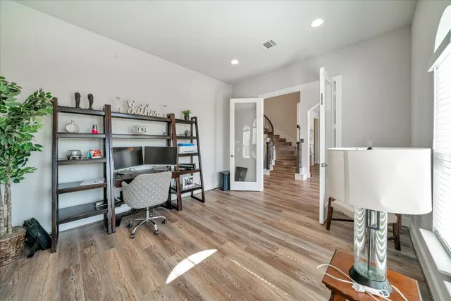 a large kitchen with a table and chairs