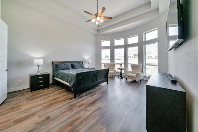 a bed room with a bed and a television