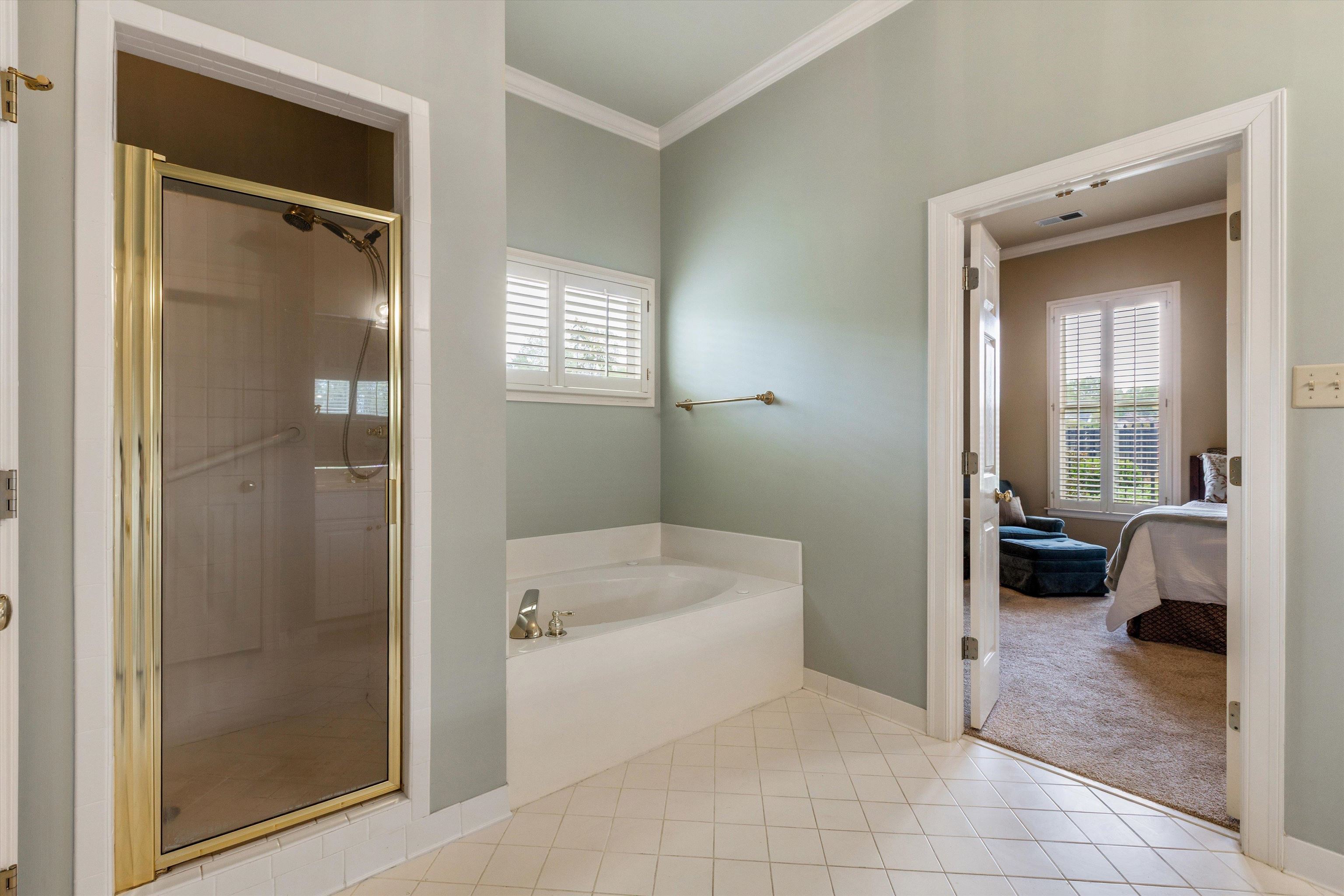1707 Wainwright Court Collierville, TN 38017 - Photo 12 of 24 a bathroom with a tub shower and sink