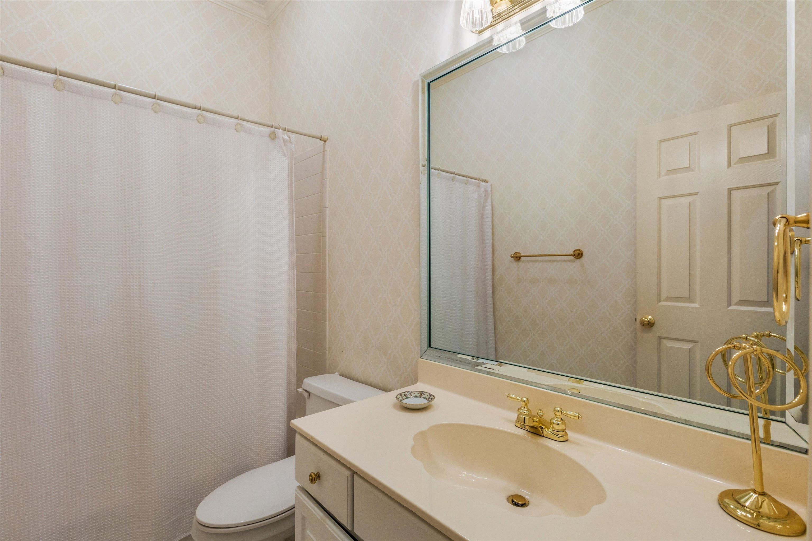 1707 Wainwright Court Collierville, TN 38017 - Photo 14 of 24 a bathroom with a sink and a mirror
