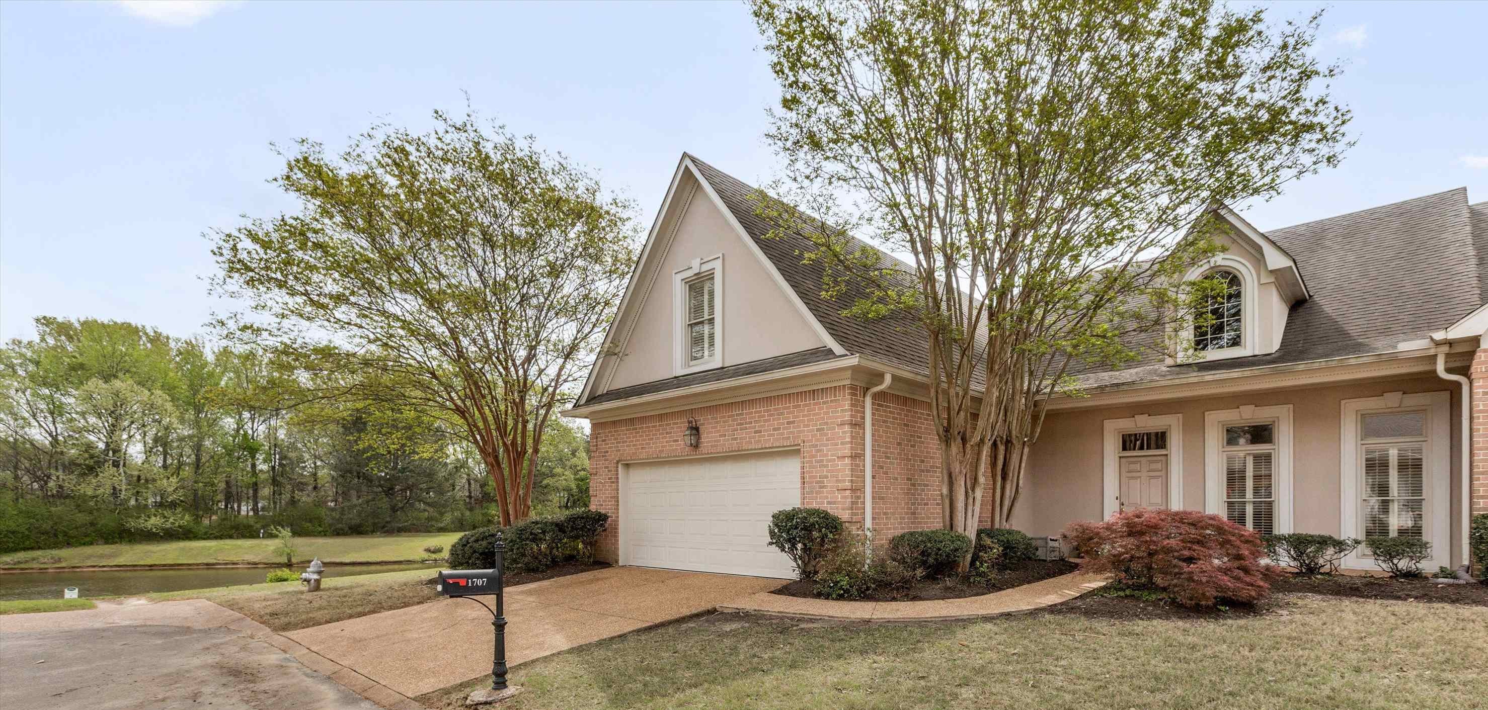 1707 Wainwright Court Collierville, TN 38017 - Photo 19 of 24 a front view of a house with sitting area