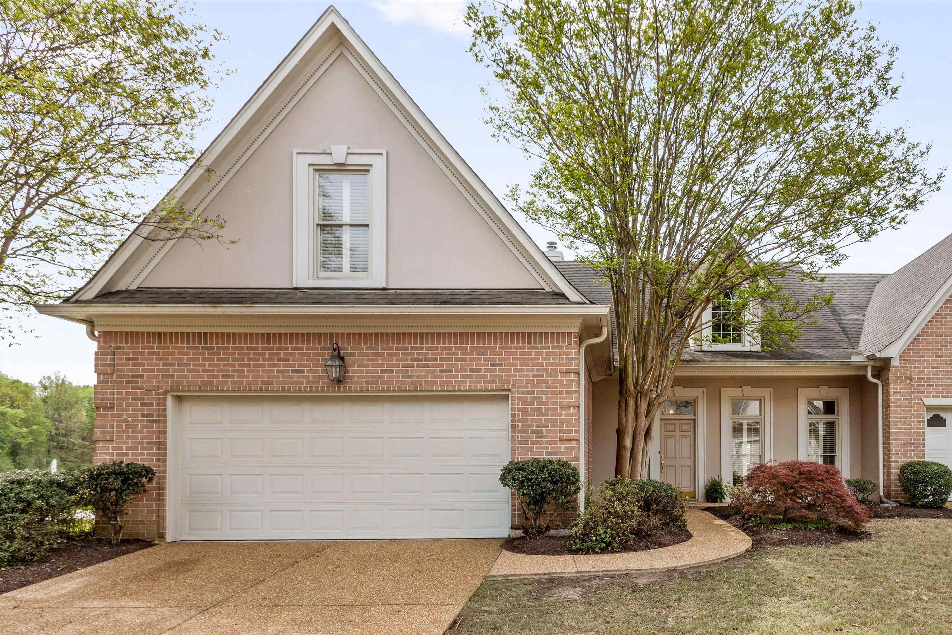 1707 Wainwright Court Collierville, TN 38017 - Photo 20 of 24 a front view of a house with garden