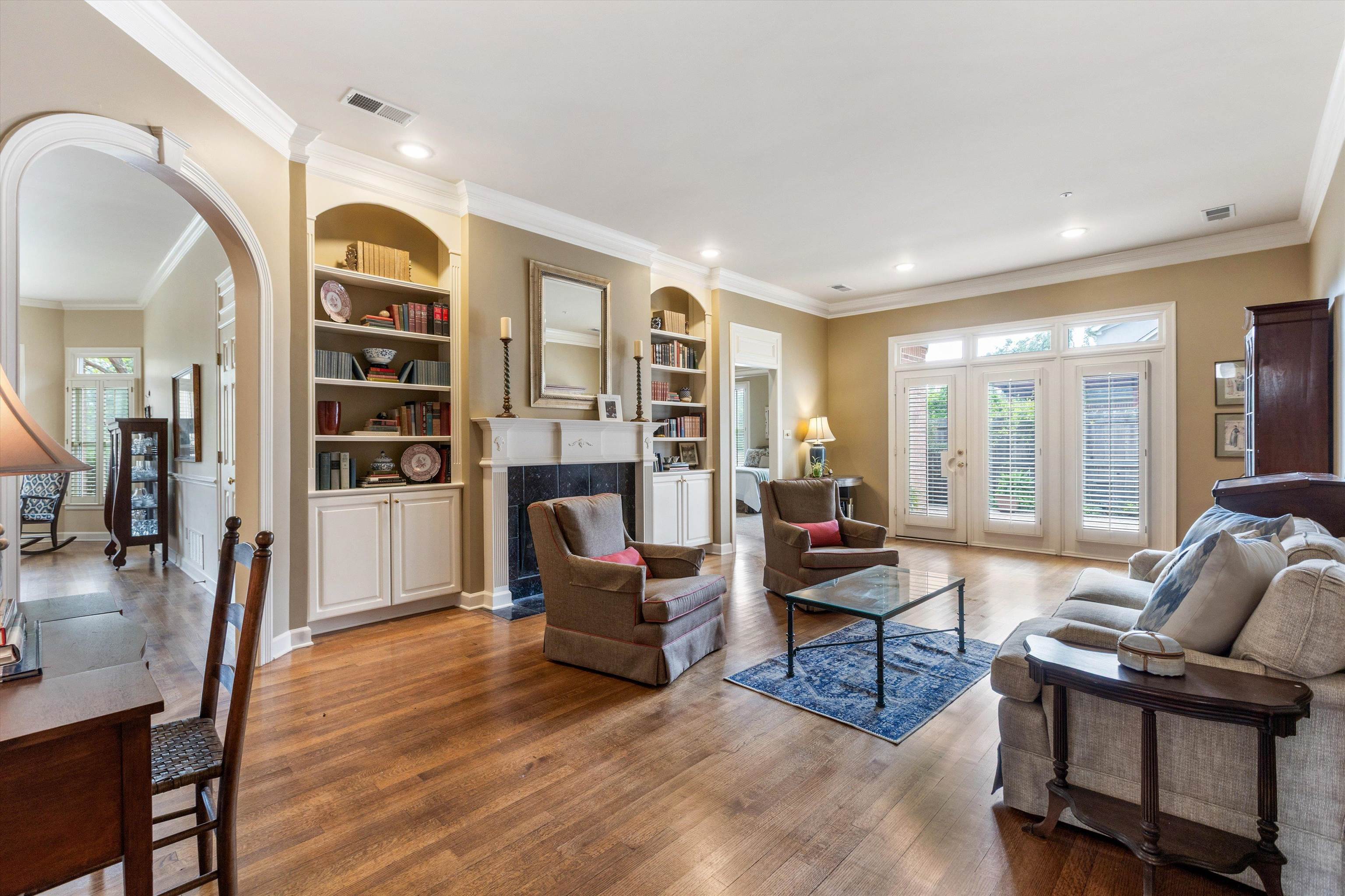 1707 Wainwright Court Collierville, TN 38017 - Photo 2 of 24 a living room with furniture a fireplace and a large window