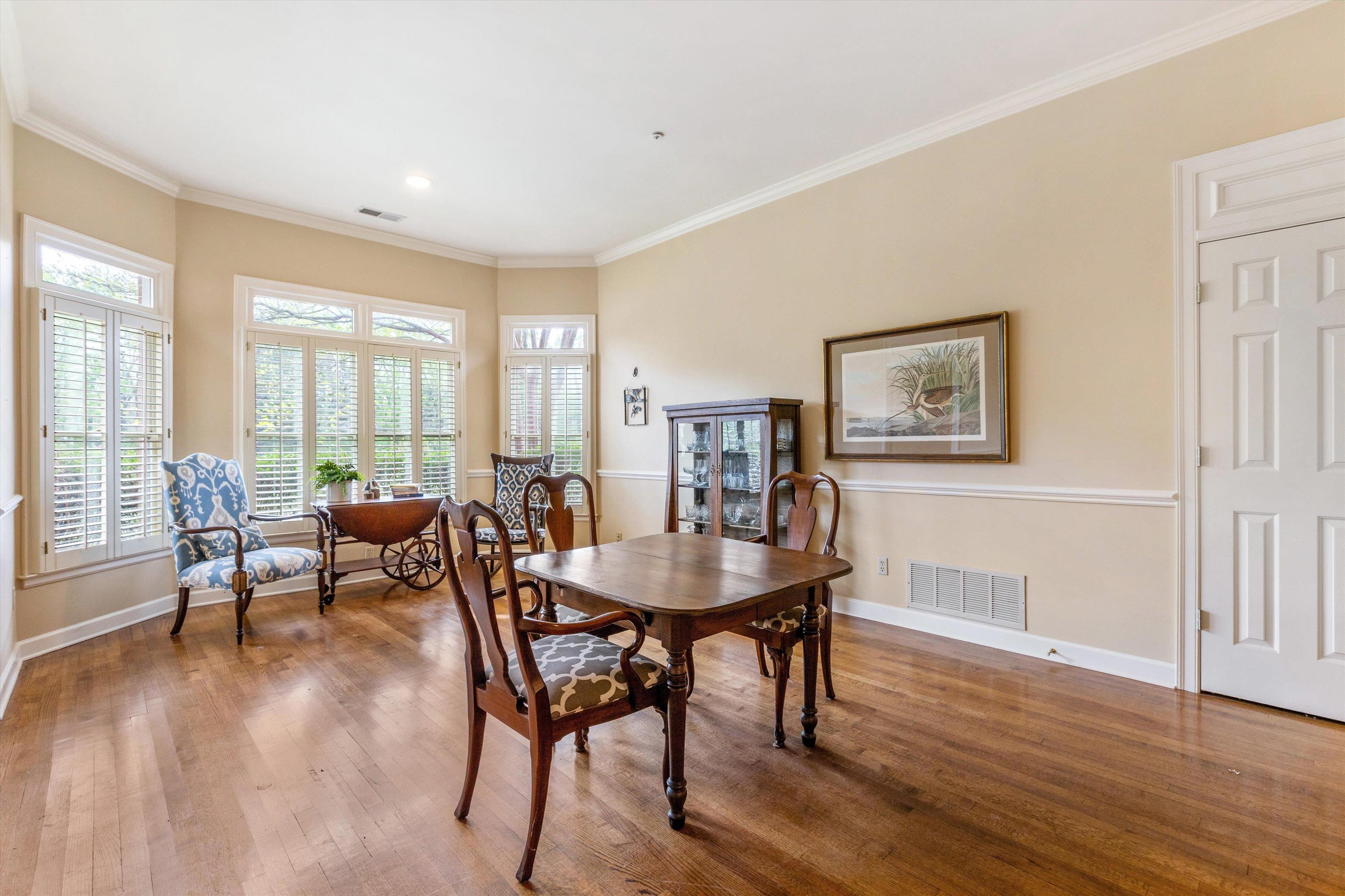 1707 Wainwright Court Collierville, TN 38017 - Photo 8 of 24 a dining room with furniture and wooden floor