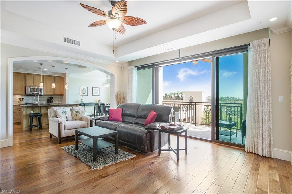 9123 Strada Place, Unit 7307 Naples, FL 34108 - Photo 12 of 49 a living room with furniture and a large window