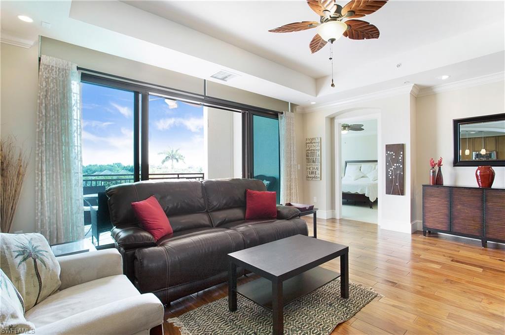 9123 Strada Place, Unit 7307 Naples, FL 34108 - Photo 19 of 49 a living room with furniture and a large window