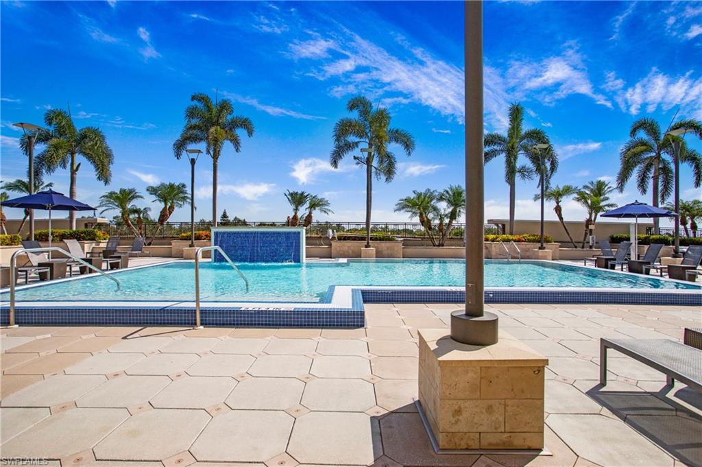 9123 Strada Place, Unit 7307 Naples, FL 34108 - Photo 2 of 49 a view of a patio with a fountain