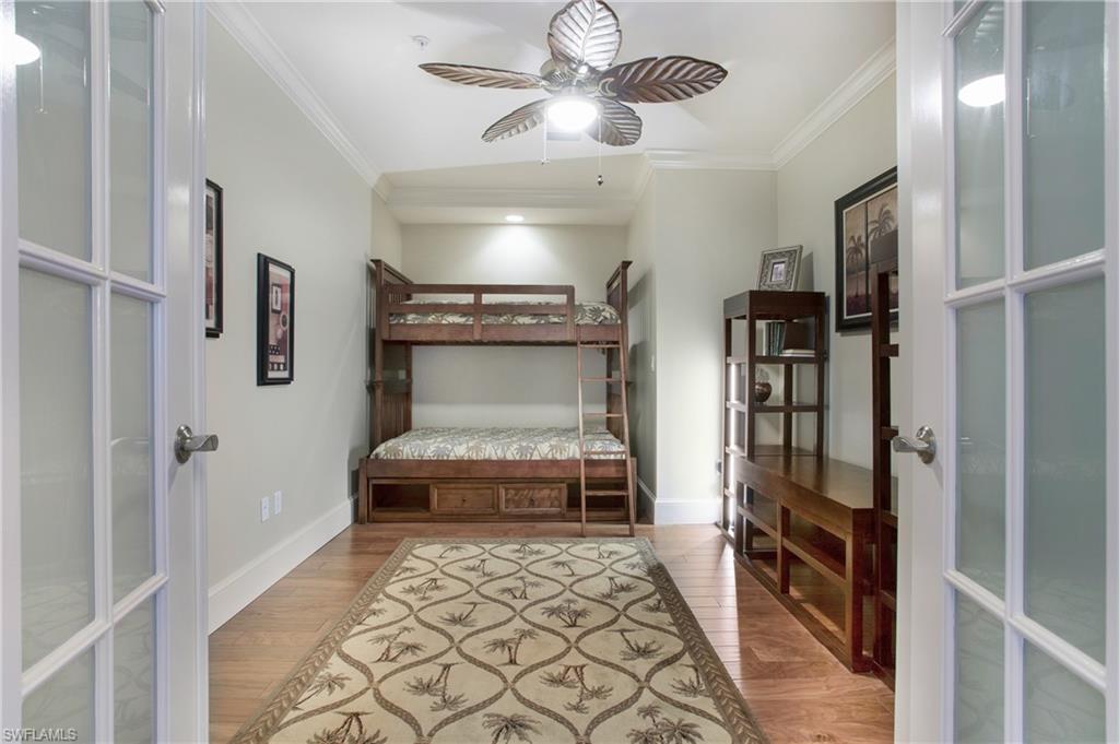 9123 Strada Place, Unit 7307 Naples, FL 34108 - Photo 28 of 49 a room with walk in closet and a chandelier