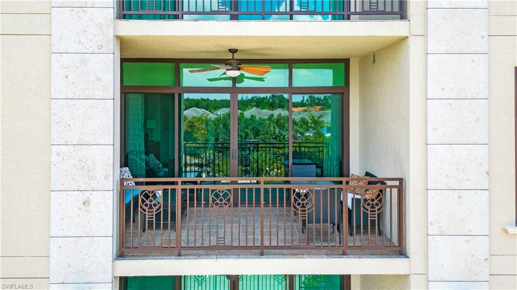 9123 Strada Place, Unit 7307 Naples, FL 34108 - Photo 31 of 49 a view of a porch with furniture