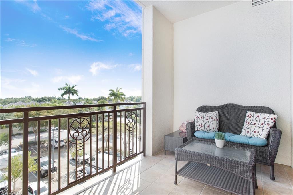 9123 Strada Place, Unit 7307 Naples, FL 34108 - Photo 32 of 49 a view of a balcony with furniture