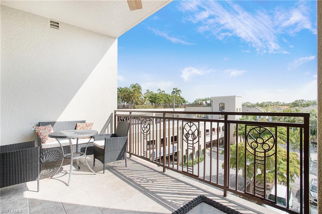 9123 Strada Place, Unit 7307 Naples, FL 34108 - Photo 33 of 49 a view of a chairs and table in patio