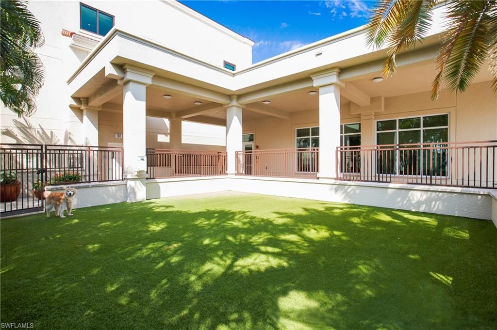 9123 Strada Place, Unit 7307 Naples, FL 34108 - Photo 40 of 49 a swimming pool with outdoor seating and yard