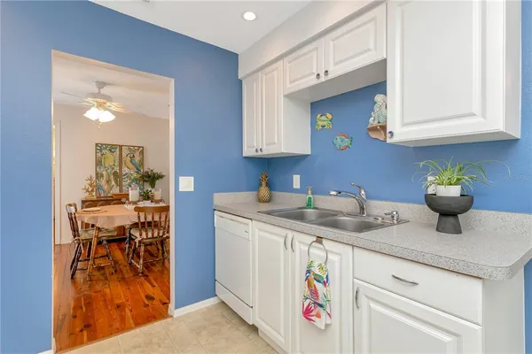 a kitchen with a sink and cabinets