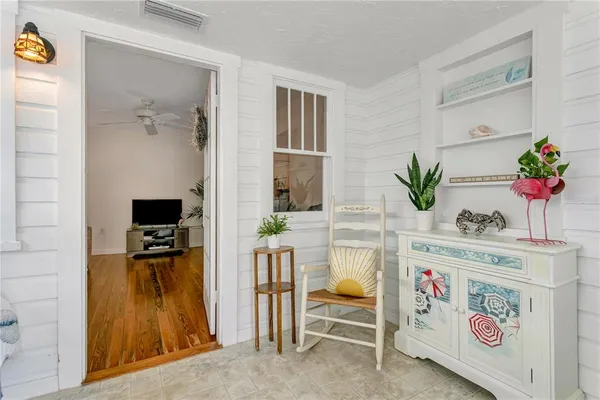 a room with furniture and a potted plant