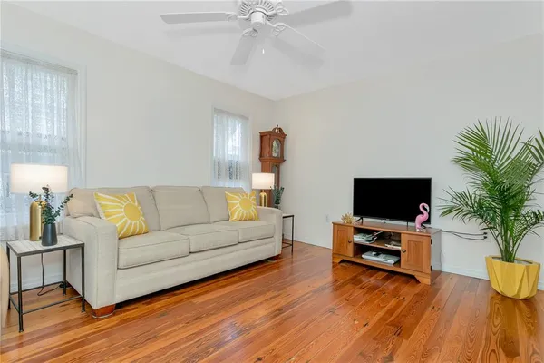 a living room with furniture and a flat screen tv