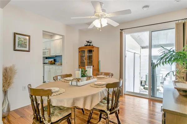 a view of a dining room with furniture window and wooden floor