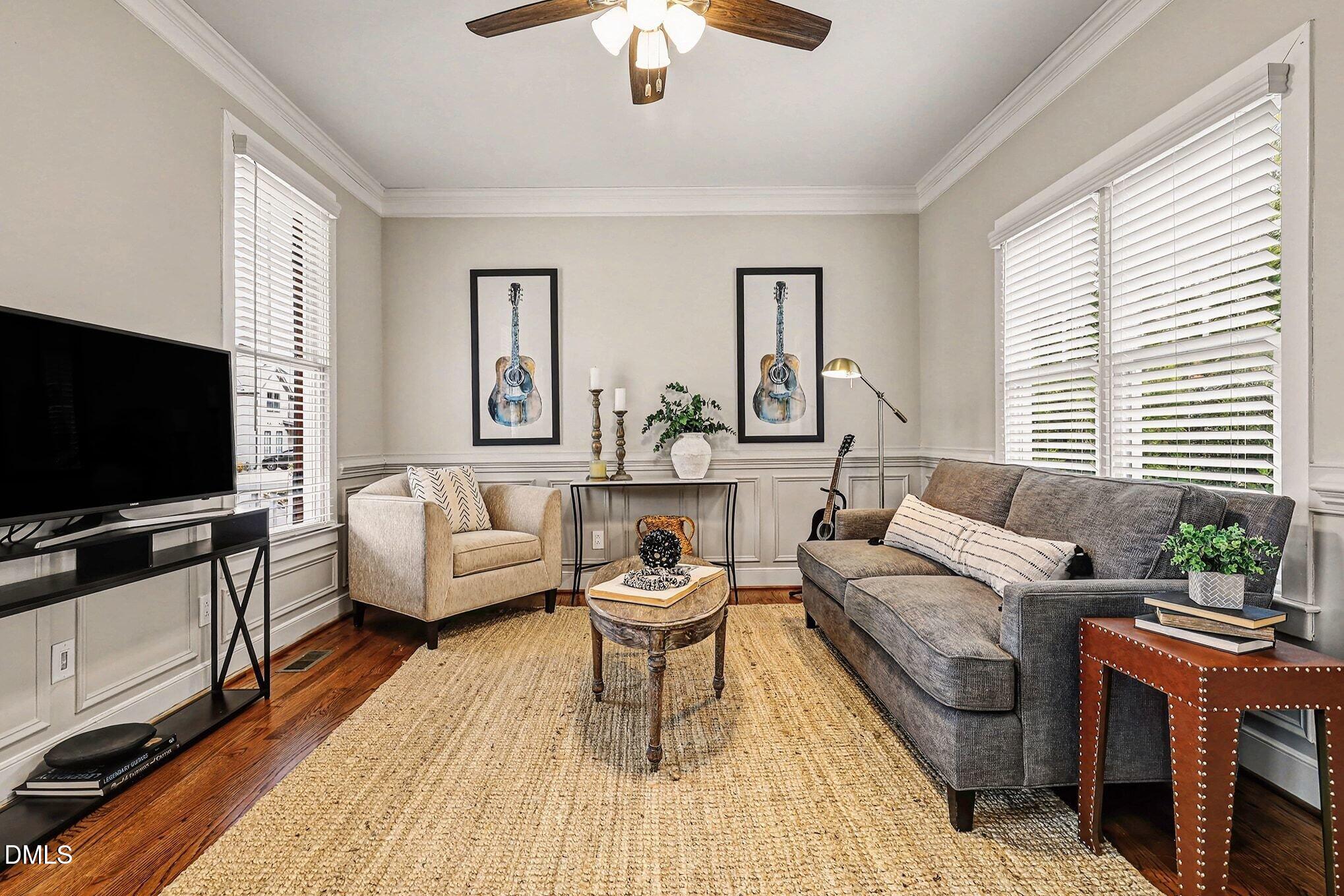 1340 Courtland Drive Raleigh, NC 27604 - Photo 11 of 42 a living room with furniture and a flat screen tv