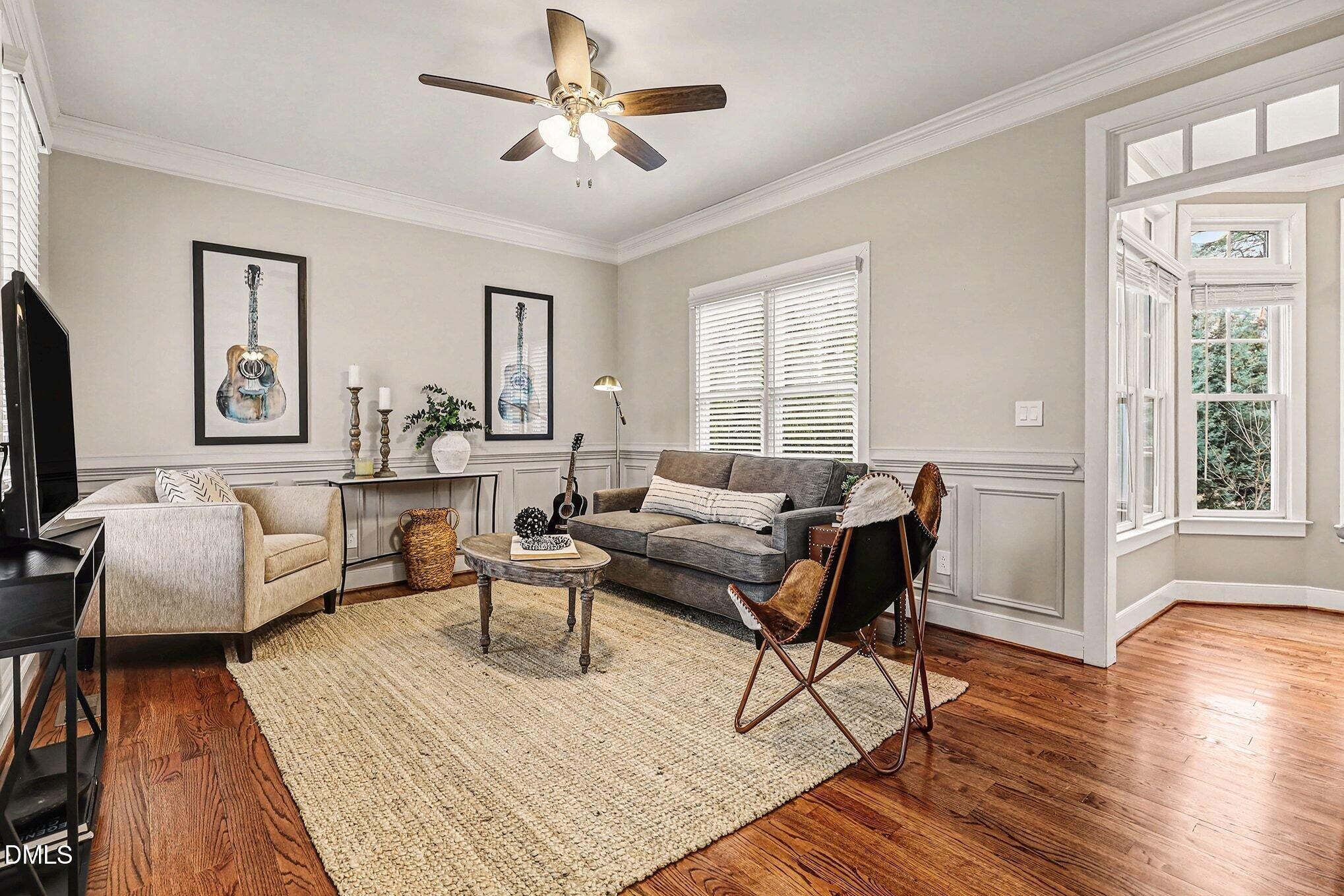 1340 Courtland Drive Raleigh, NC 27604 - Photo 13 of 42 a living room with furniture and a wooden floor