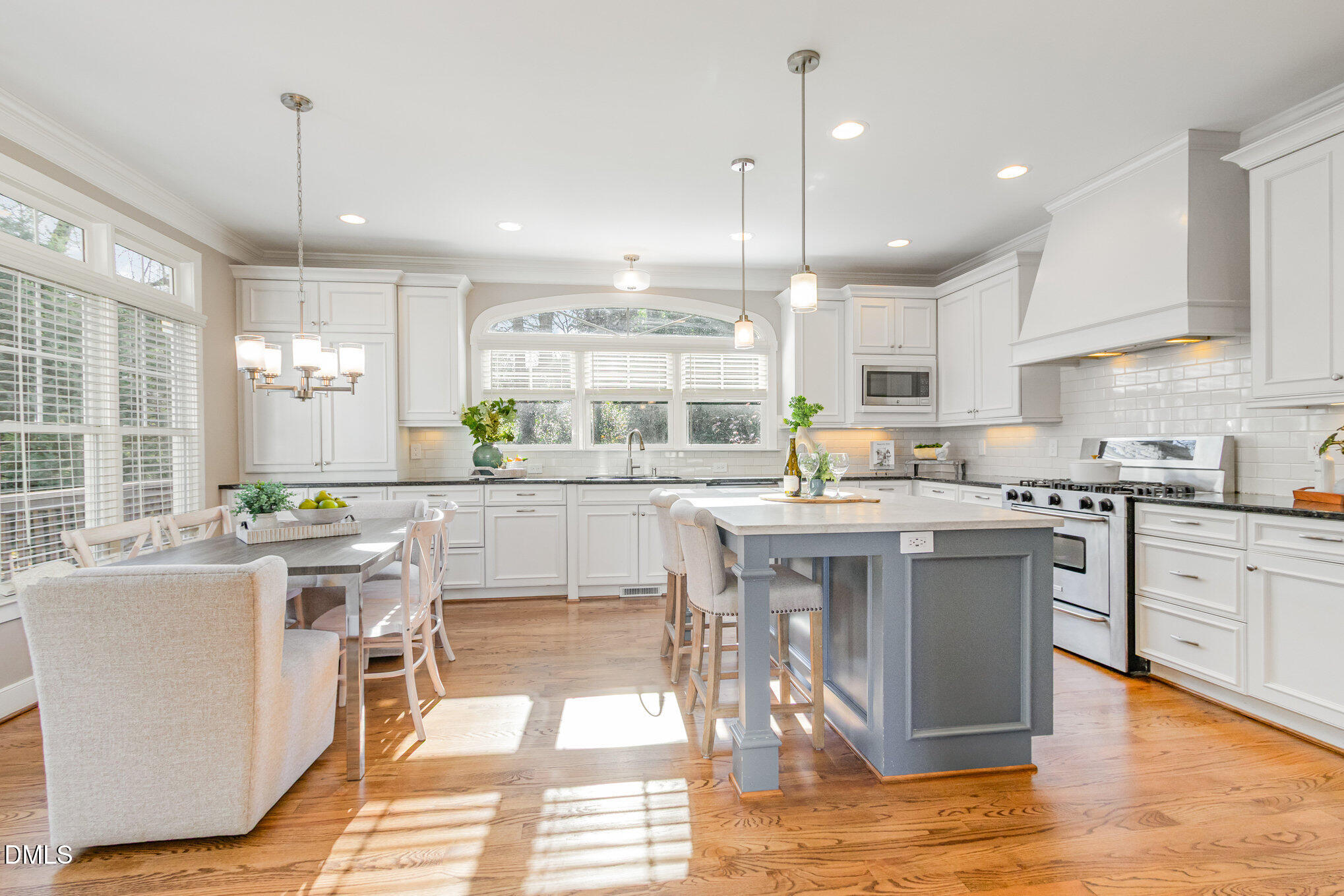 1340 Courtland Drive Raleigh, NC 27604 - Photo 15 of 42 a kitchen with a sink a counter top stainless steel appliances and cabinets