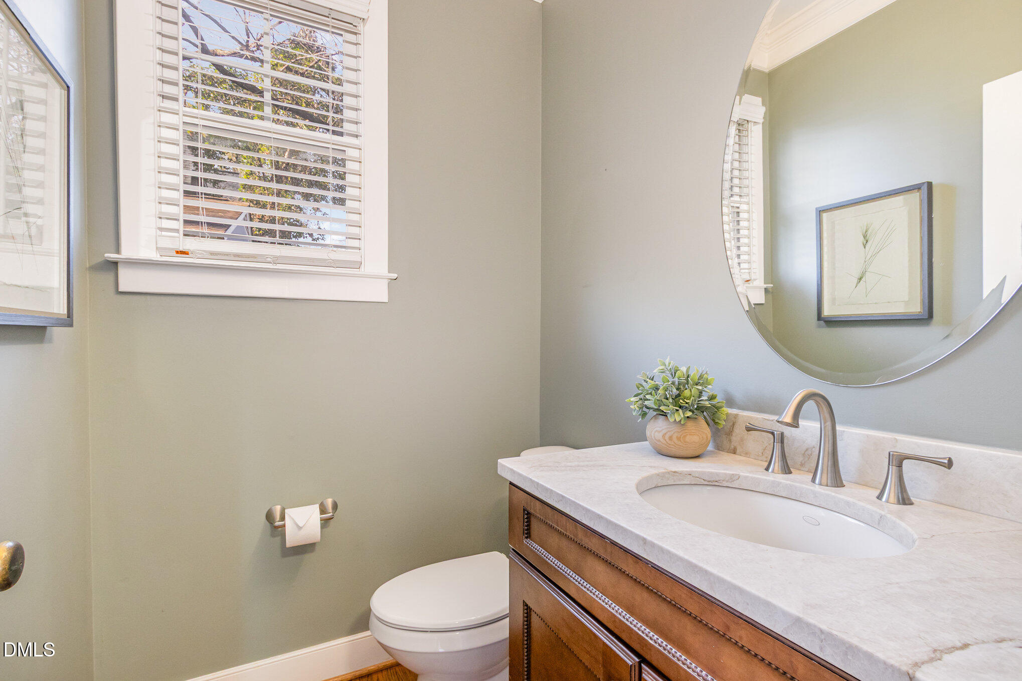 1340 Courtland Drive Raleigh, NC 27604 - Photo 18 of 42 a bathroom with a granite countertop toilet sink and mirror
