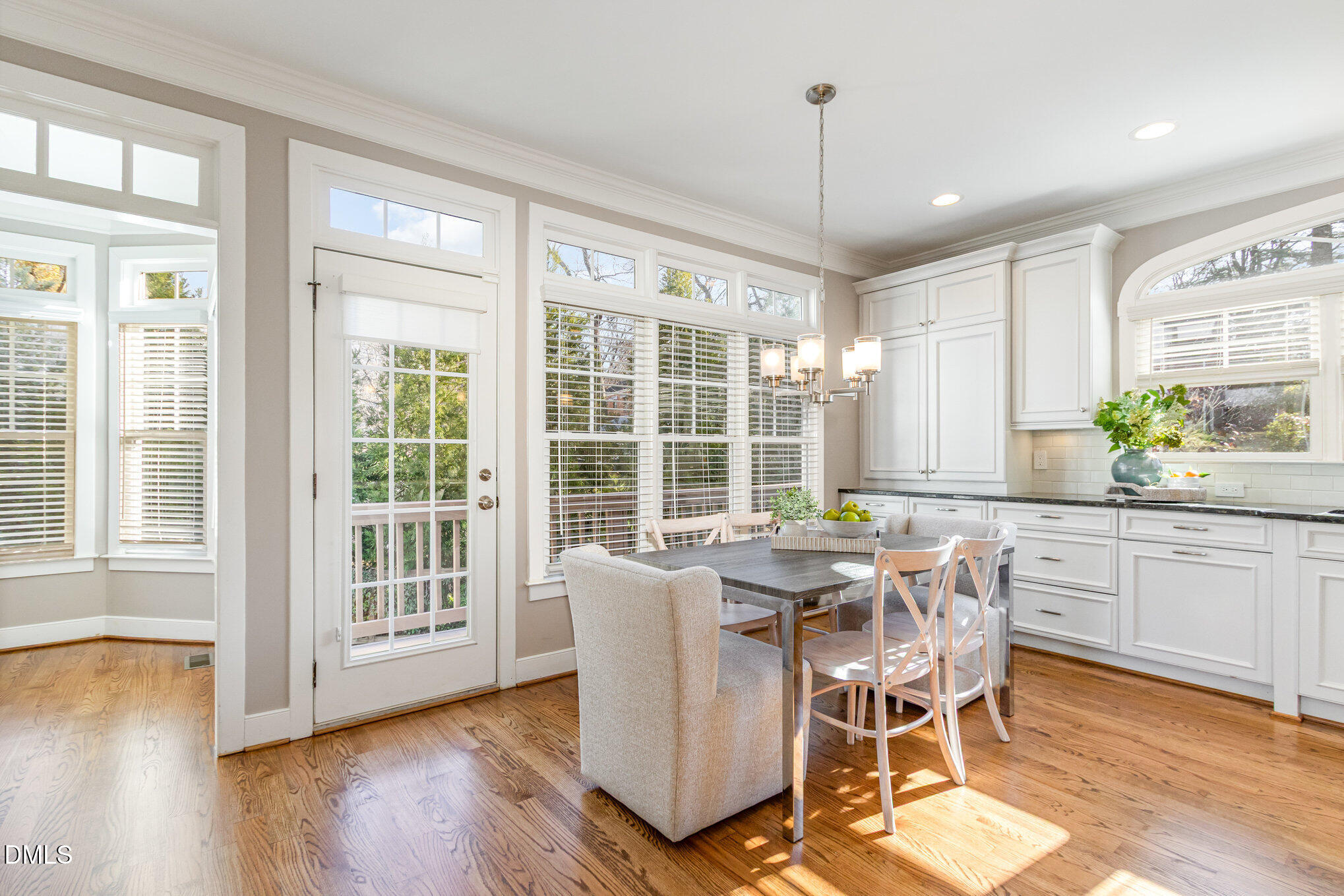 1340 Courtland Drive Raleigh, NC 27604 - Photo 19 of 42 a dining room with furniture window wooden floor
