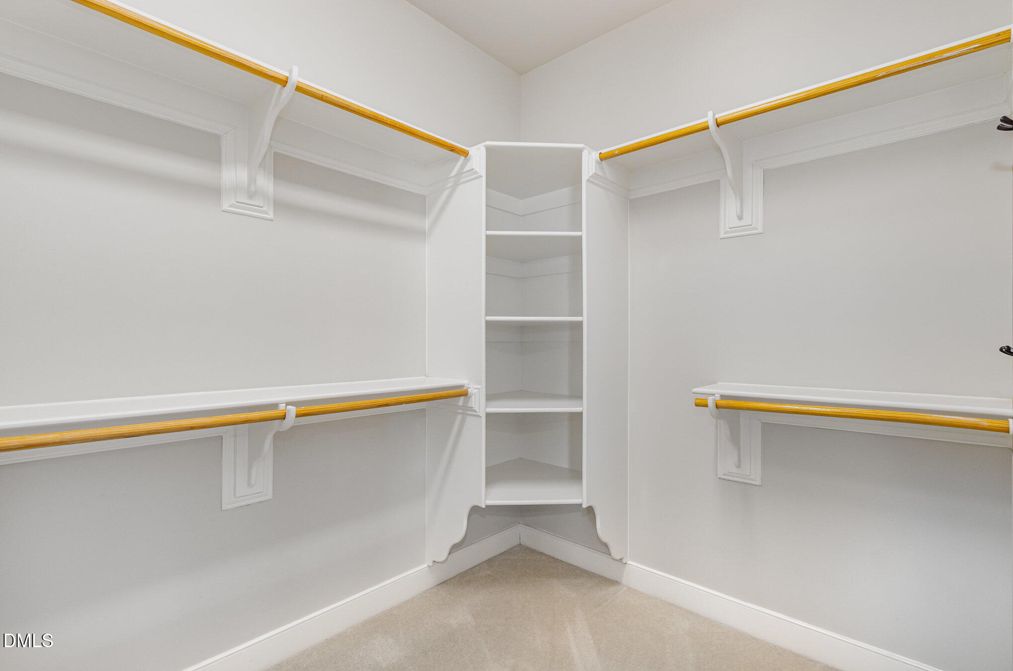 1340 Courtland Drive Raleigh, NC 27604 - Photo 23 of 42 a view of walk in closet with empty racks