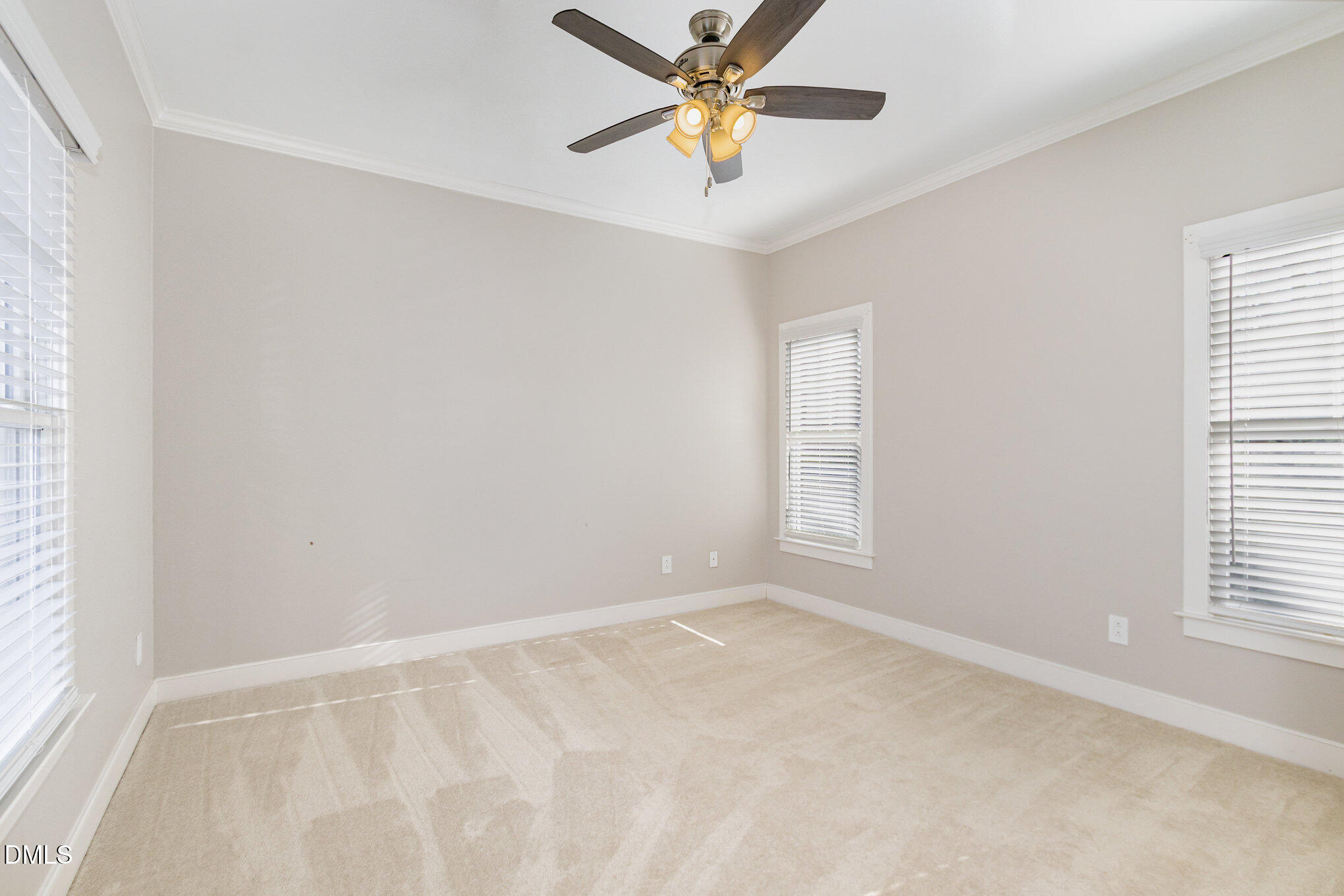 1340 Courtland Drive Raleigh, NC 27604 - Photo 24 of 42 an empty room with windows and fan