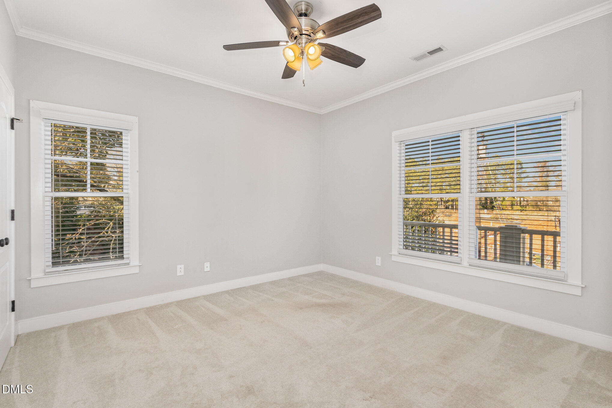 1340 Courtland Drive Raleigh, NC 27604 - Photo 25 of 42 a view of an empty room with a window and a ceiling fan