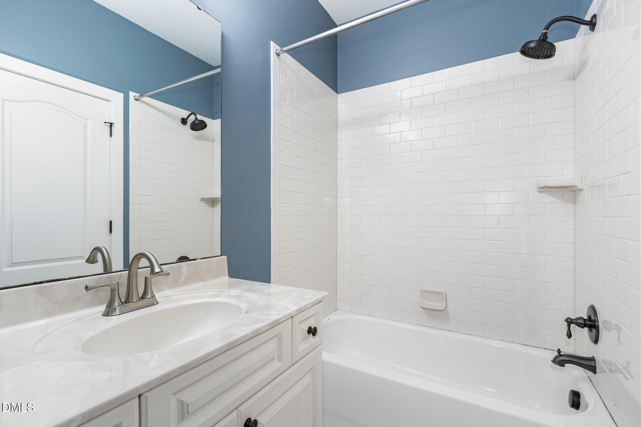 1340 Courtland Drive Raleigh, NC 27604 - Photo 26 of 42 a bathroom with a sink and a bathtub